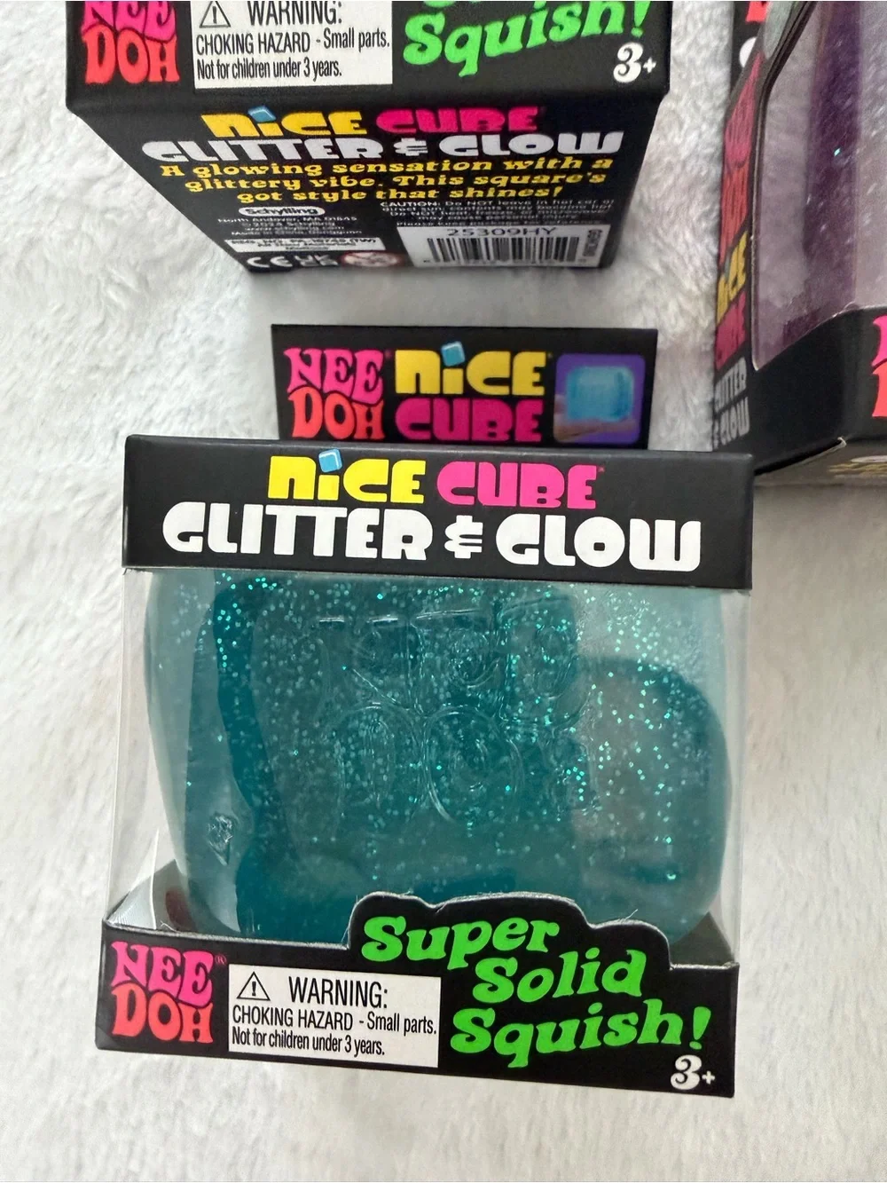 Set of Needoh Nice Cube Glitter & Glow Squishy Toys - Purple and Blue